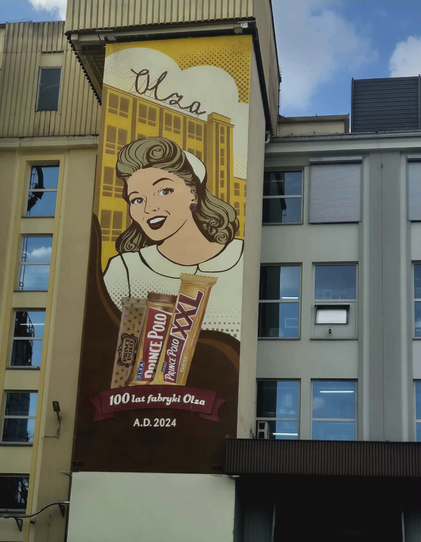 Mural na 100-lecie fabryki „Olza” na ścianie zakładów Mondelez - Tomasz Wolff "Głos